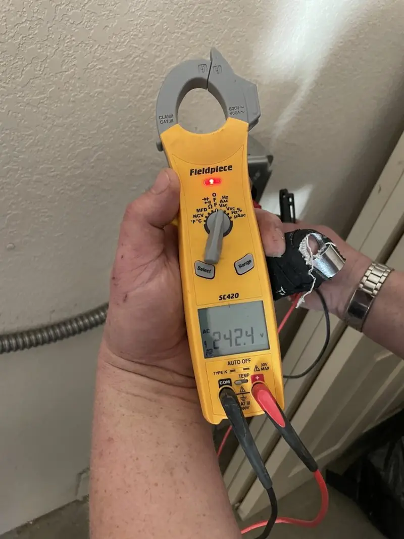 Voltage testing with clamp meter during Outlet Installation in Allentown